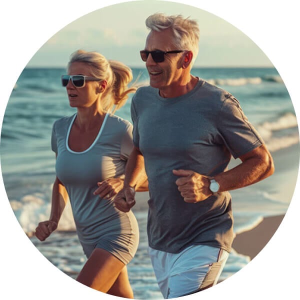 Old people running on the beach