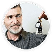 Man looking at his car keys