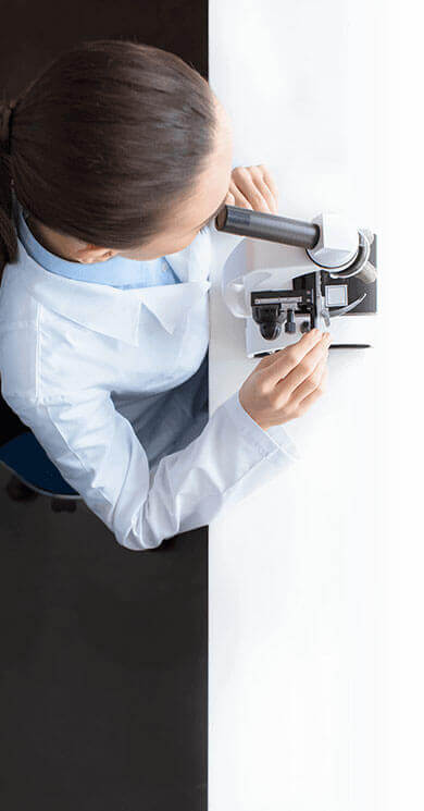 Scientist looking in a microscope