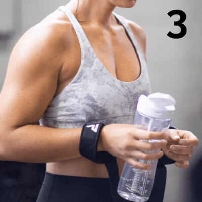 Woman holding shaker bottle